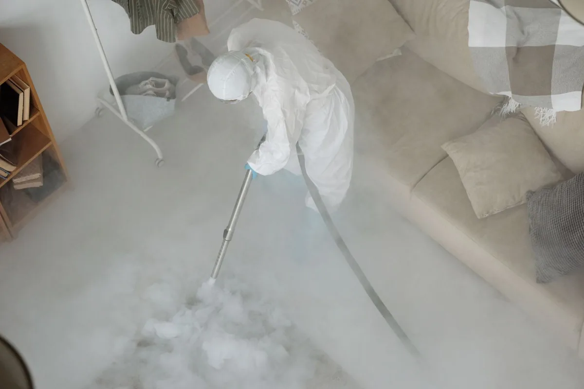 Biohazard cleanup technician in protective equipment, Port Sulphur, LA